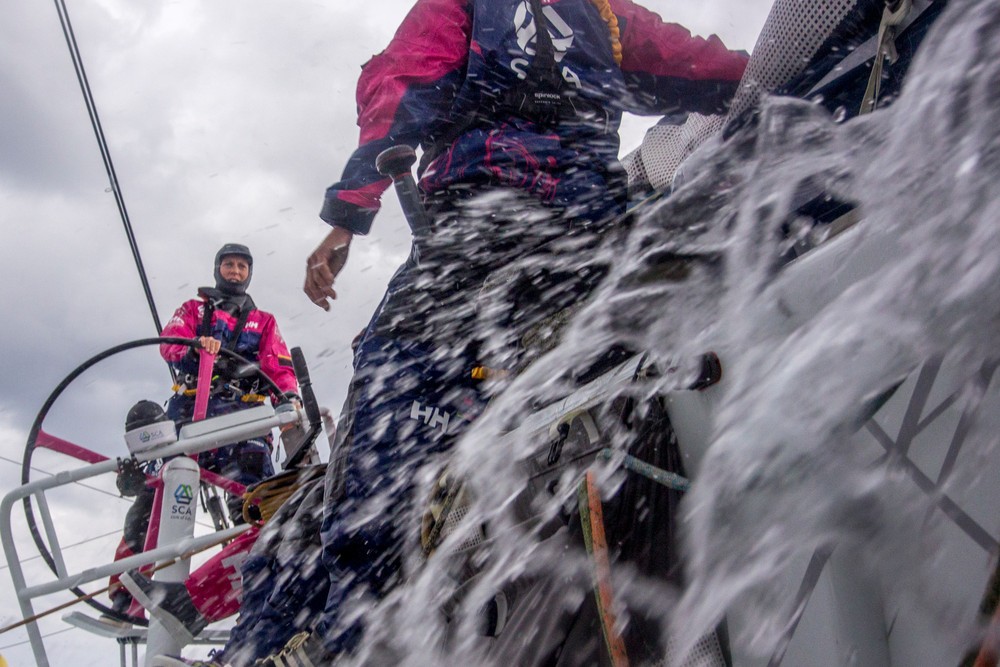 October, 2014. Leg 1 onboard Team SCA. Sam Davies gives instruction during her watch.